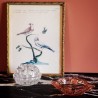 Petit pique fleurs en verre transparent.