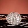 Petit pique fleurs en verre transparent.